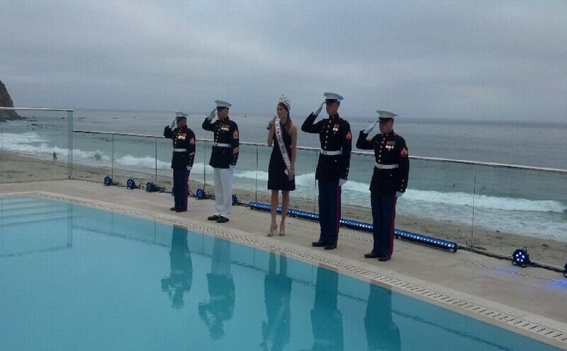 Woman and Marines Saluting