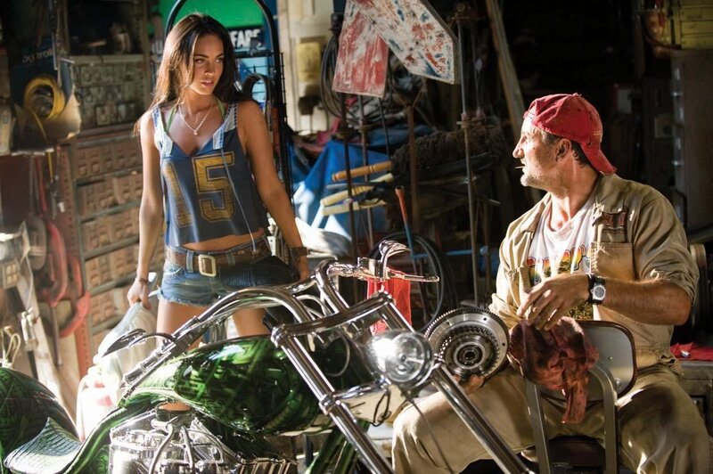 Woman and mechanic in garage