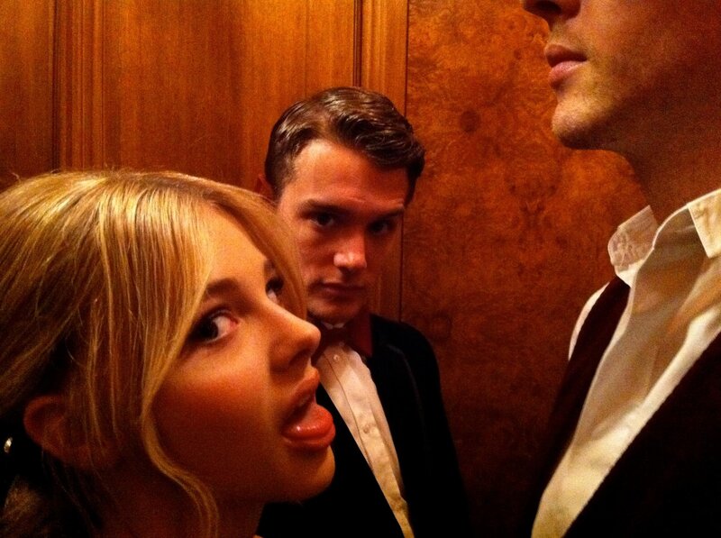 Woman and Two Men in Elevator