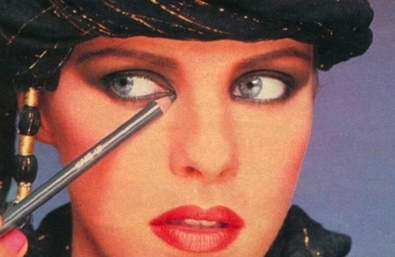 Woman Applying Eyeliner