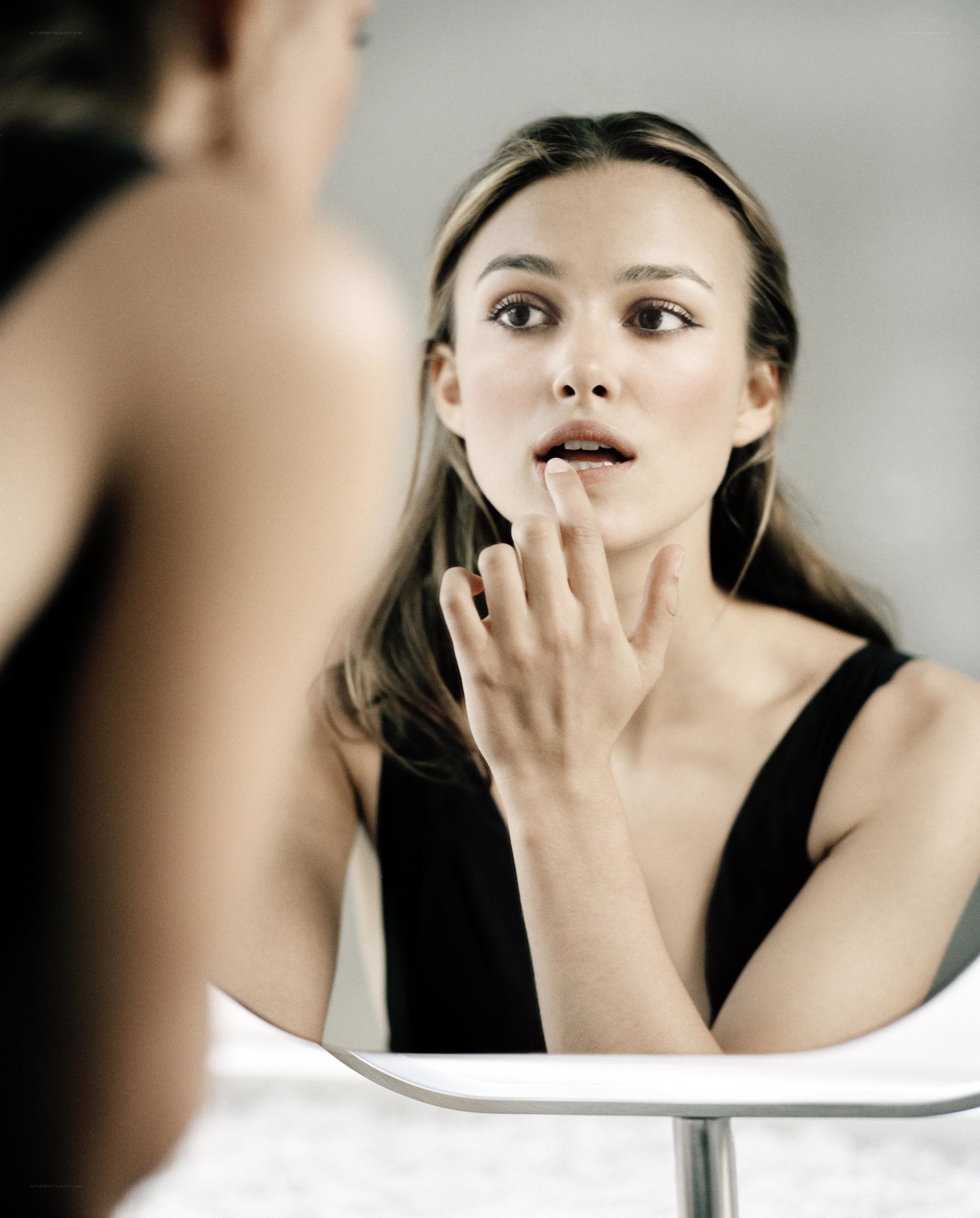 woman applying lip balm