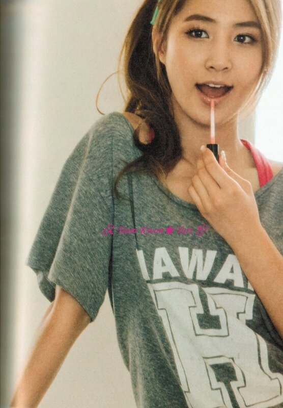 woman applying lip gloss