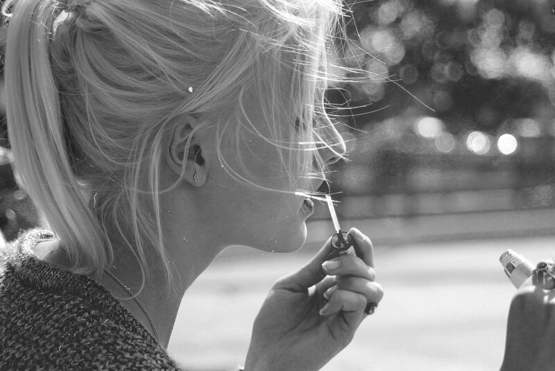 woman applying lip gloss