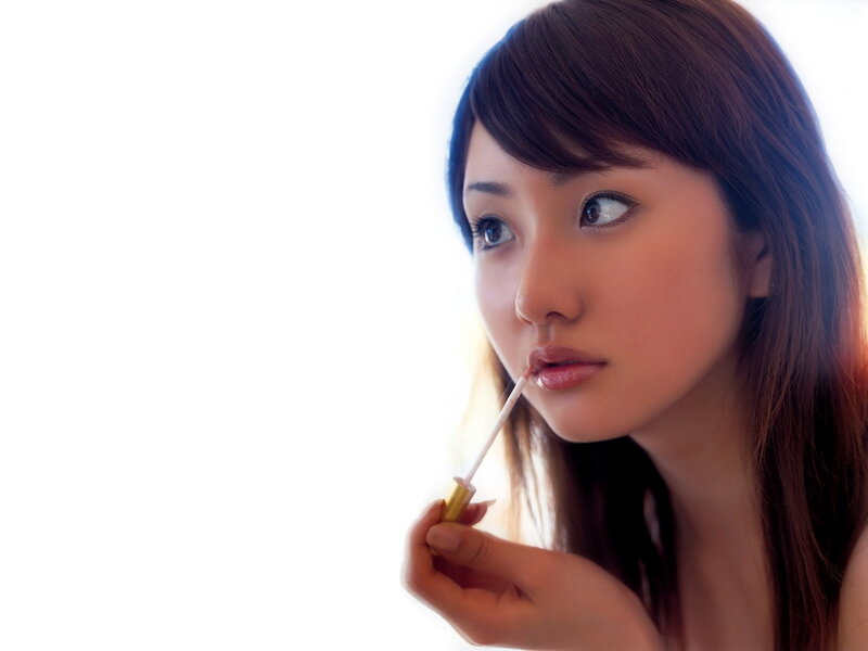 Woman Applying Lip Gloss — White, Calm