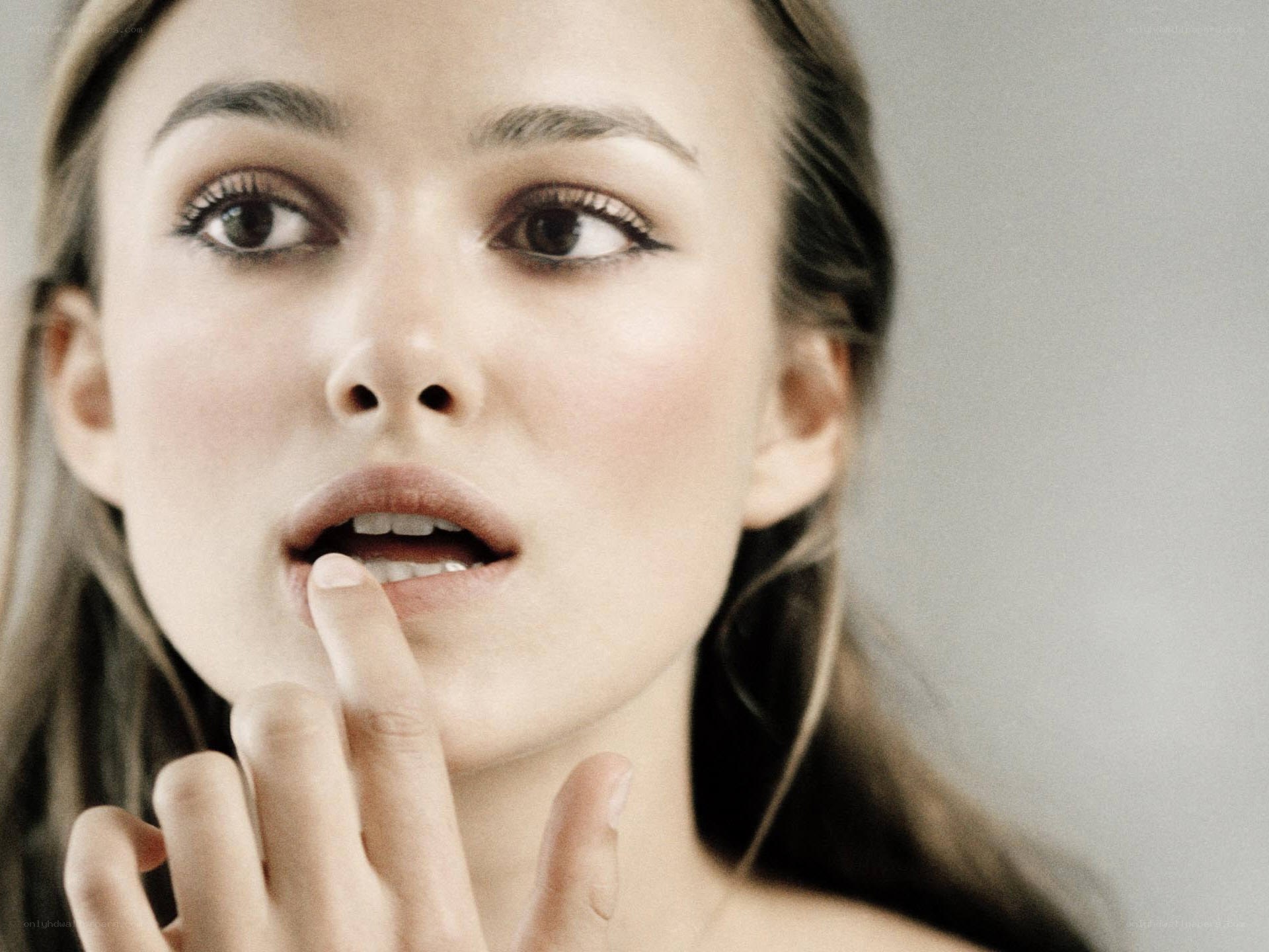 woman applying lip product