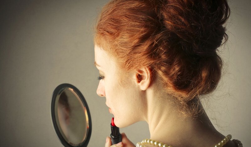 Woman Applying Lipstick — Red, Calm