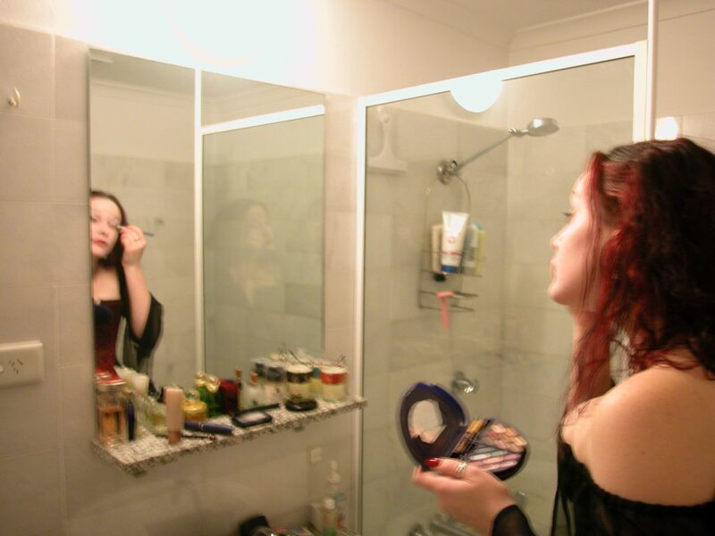 Woman Applying Makeup — Black