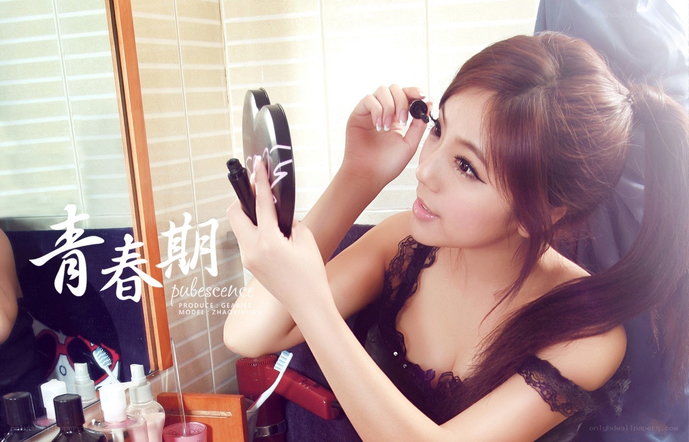 woman applying mascara