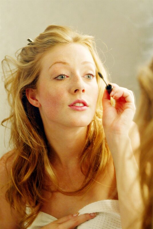 Woman Applying Mascara — Blonde, Calm