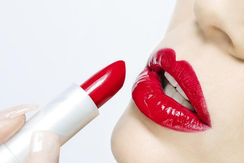 Woman Applying Red Lipstick — Neutral