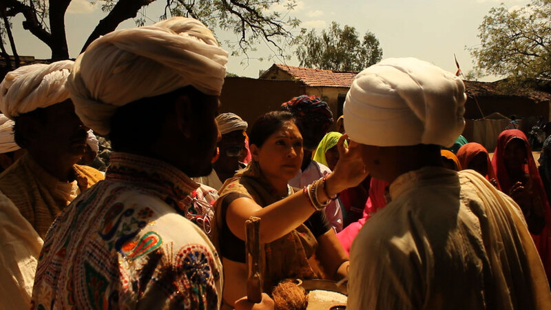 Woman Applying Sindoor to Man