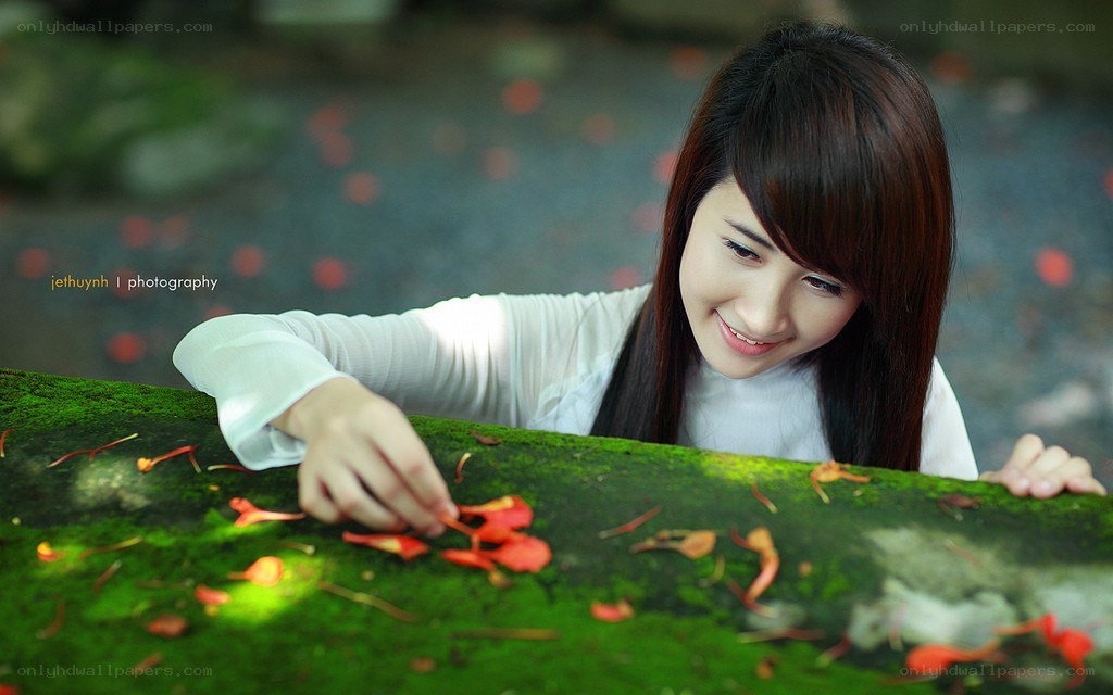 woman arranging flower petals