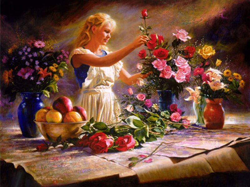 woman arranging flowers at table
