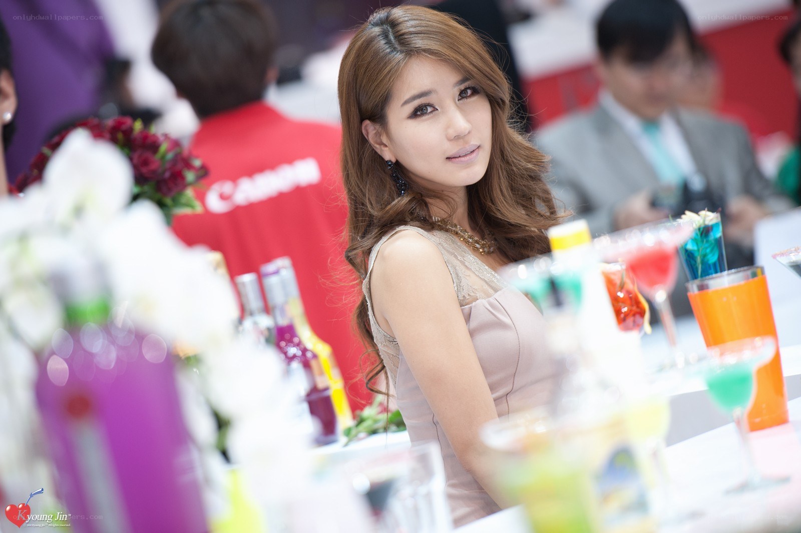 Woman at a beverage display