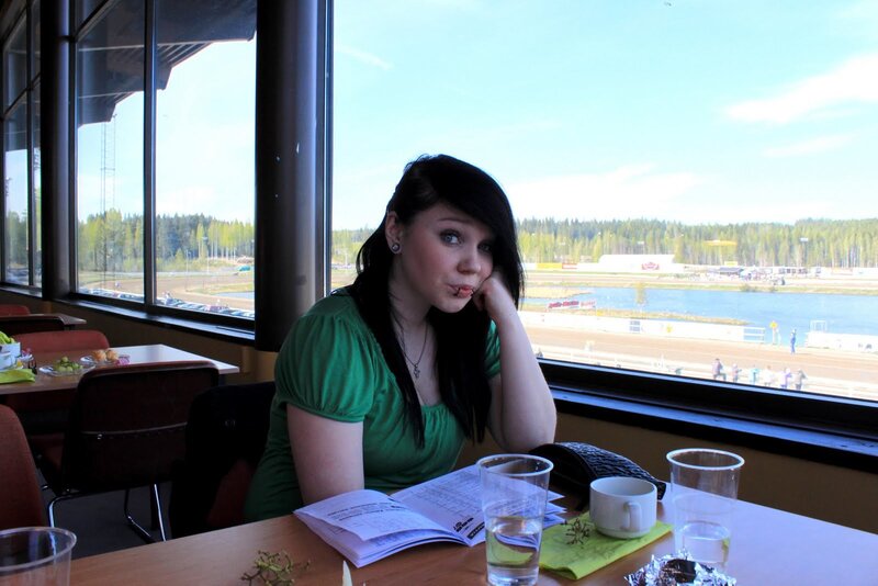 Woman at a cafe by the lake