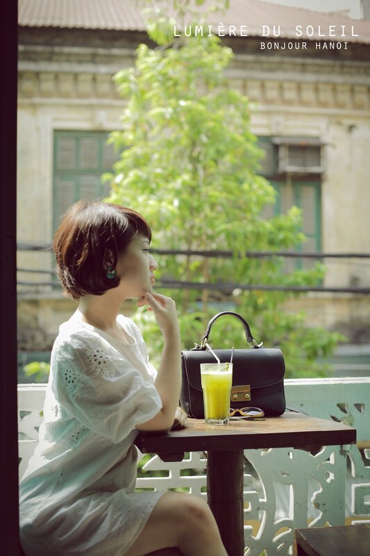Woman at a cafe in Hanoi