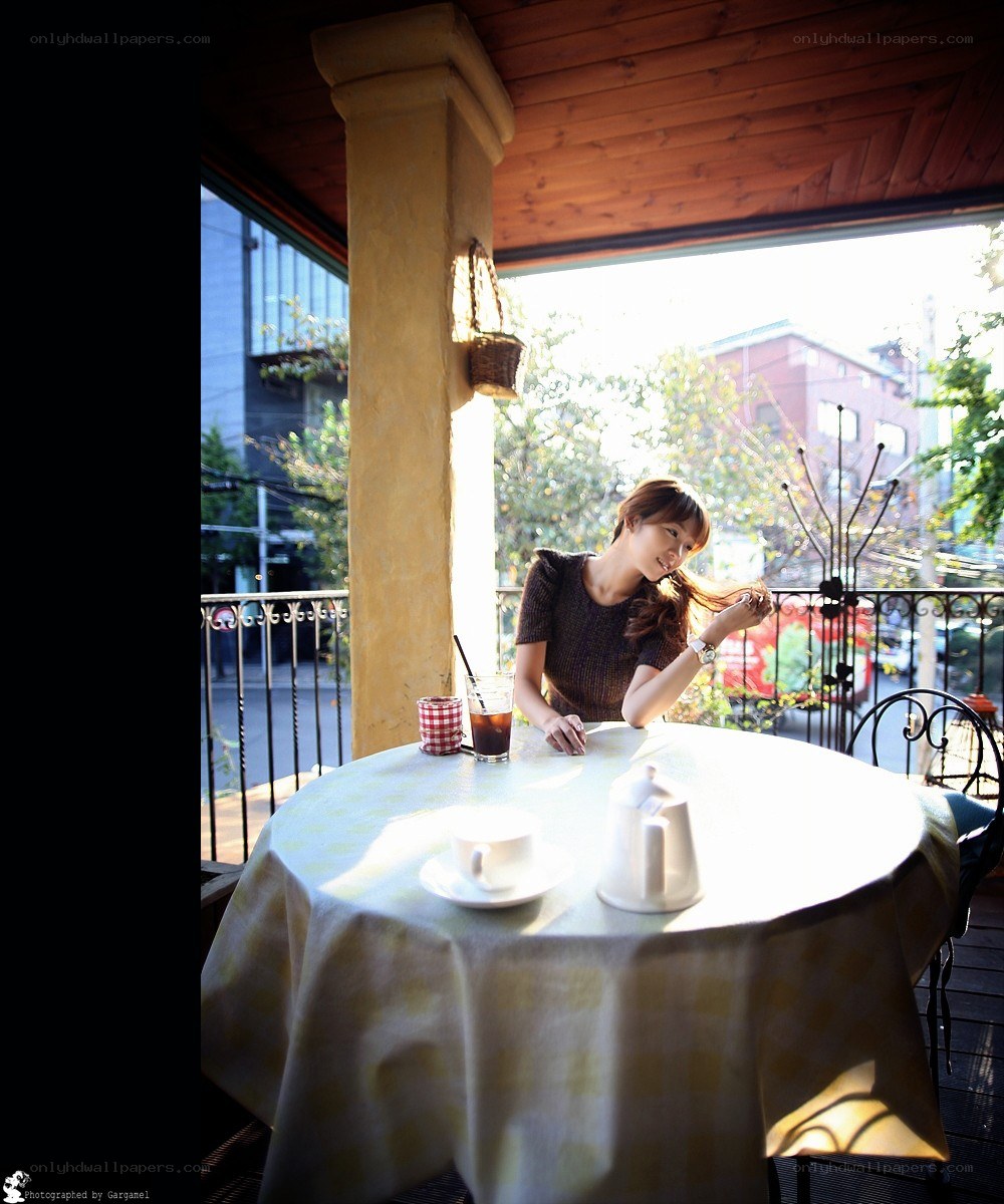 Woman at a cafe table