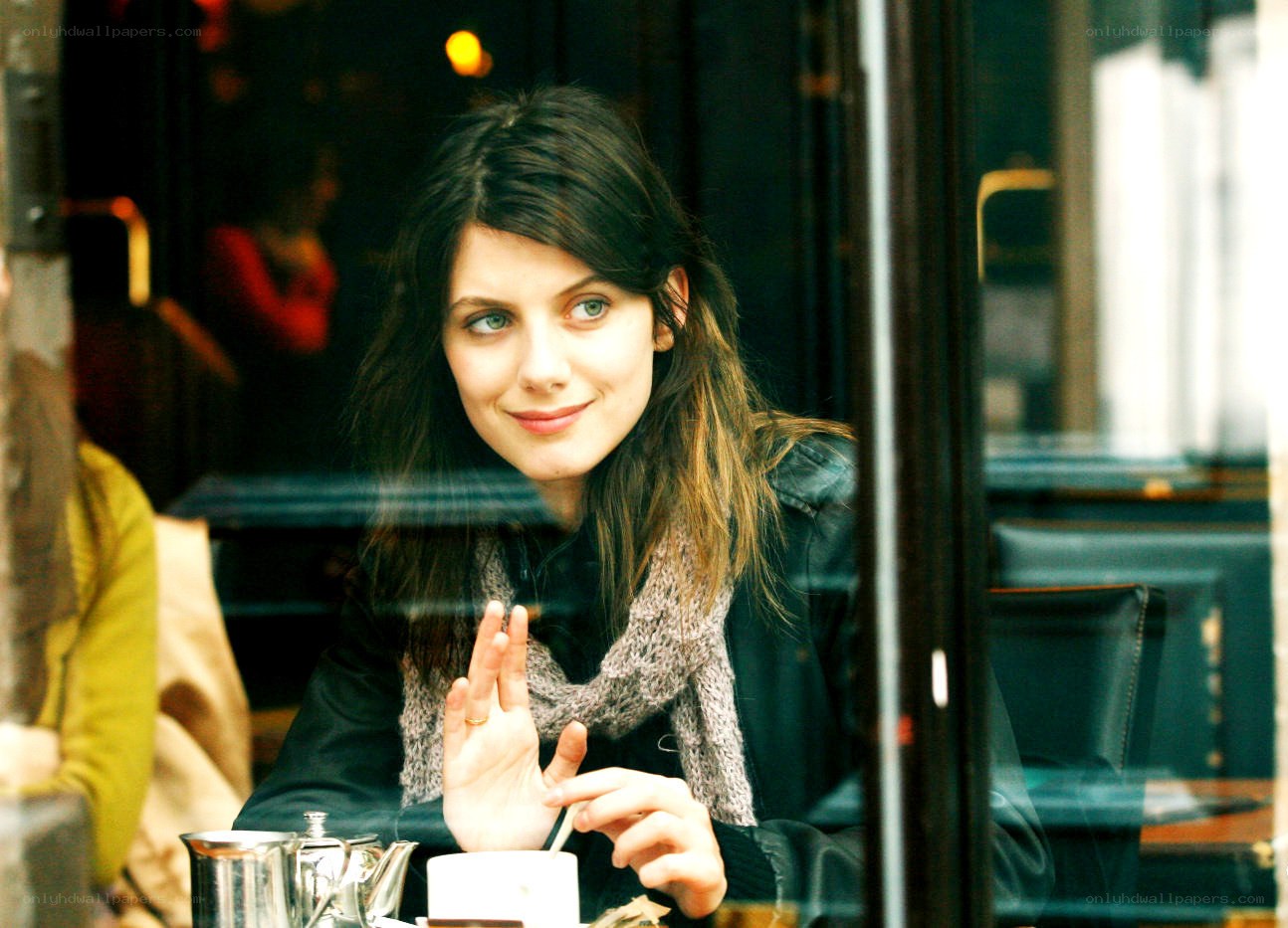 woman at a cafe window