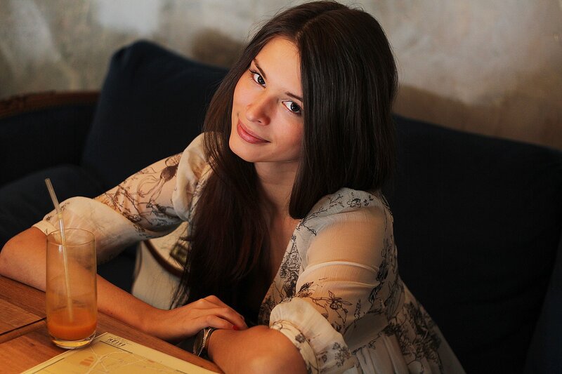 woman at a cafe with drink