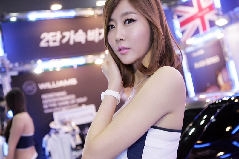Woman at a car show event