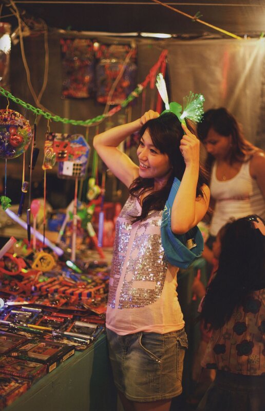 Woman at a carnival game booth