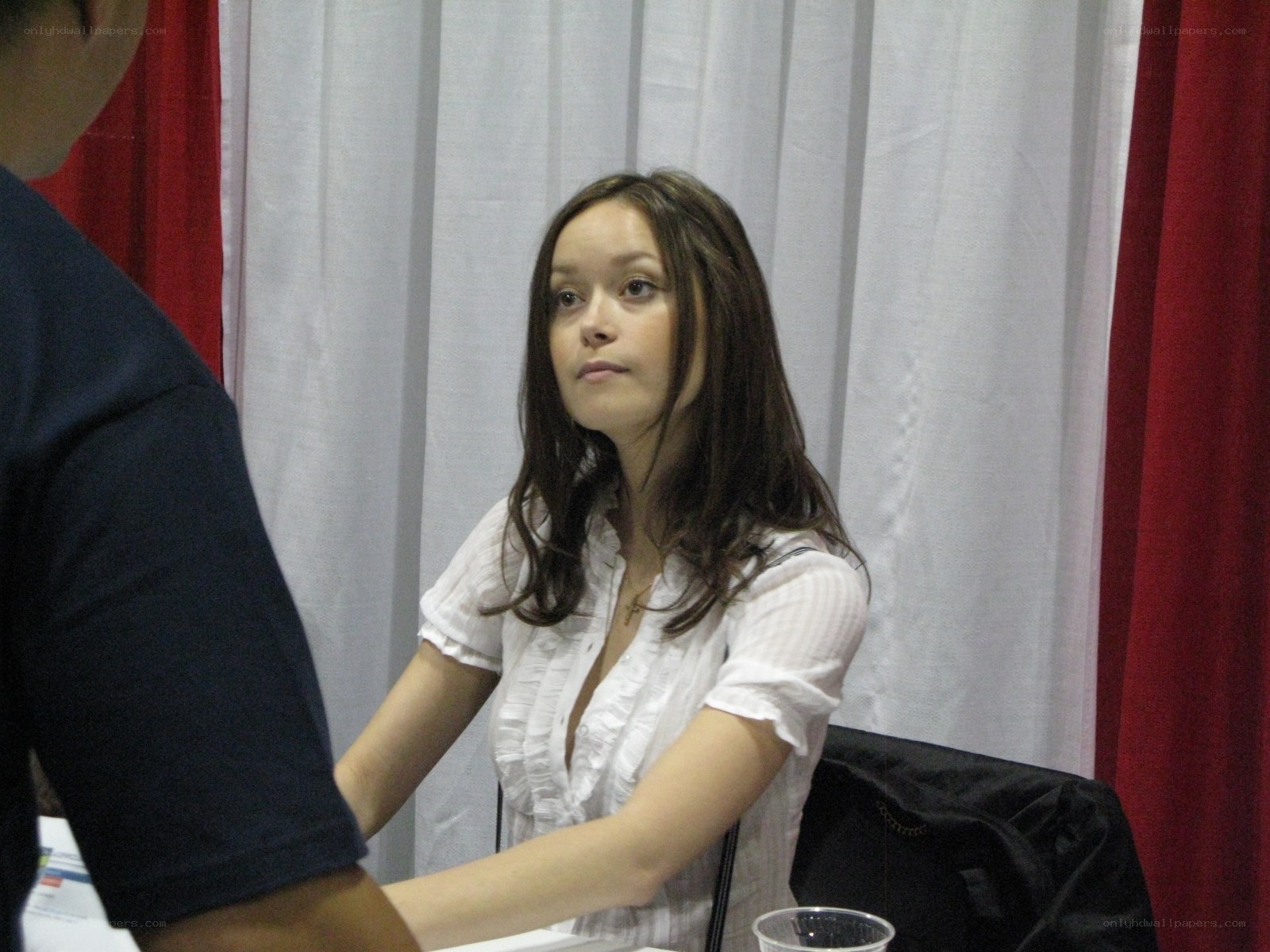 woman at a convention table
