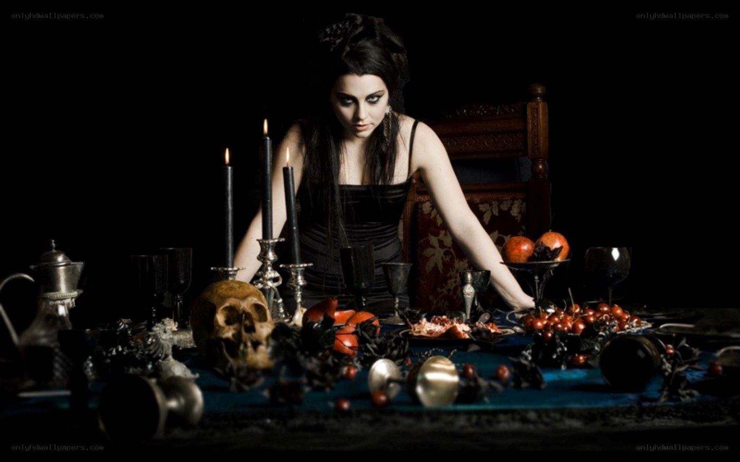 woman at a dark table