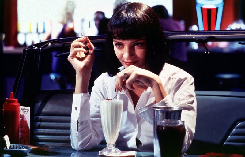 Woman at a diner with milkshake