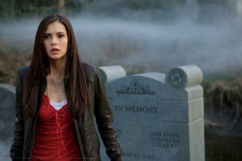 woman at a grave site