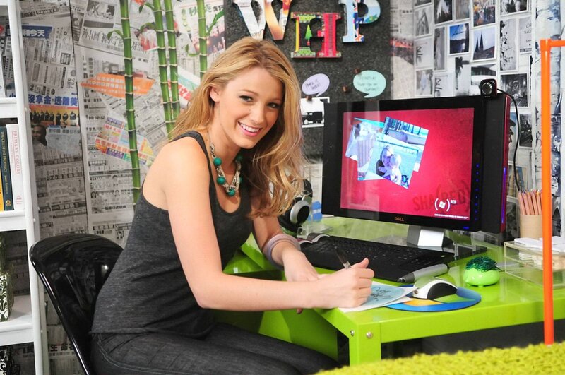 woman at a green desk