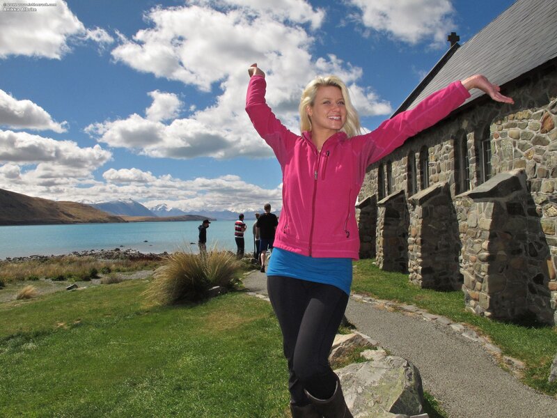 Woman at a lakeside church