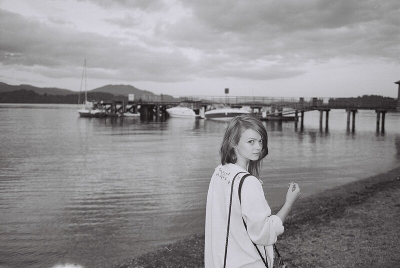 Woman at a lakeside dock