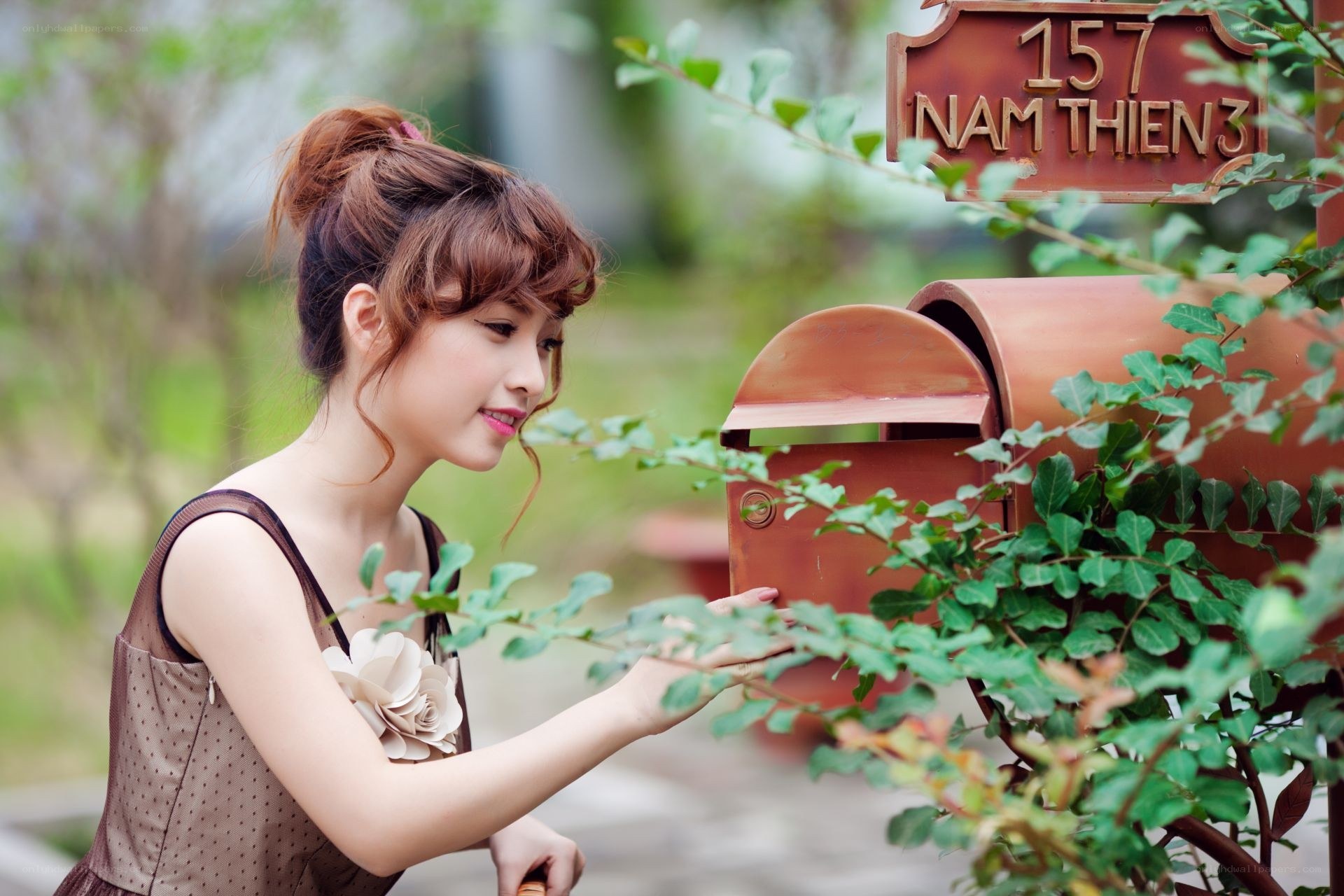 Woman at a mailbox