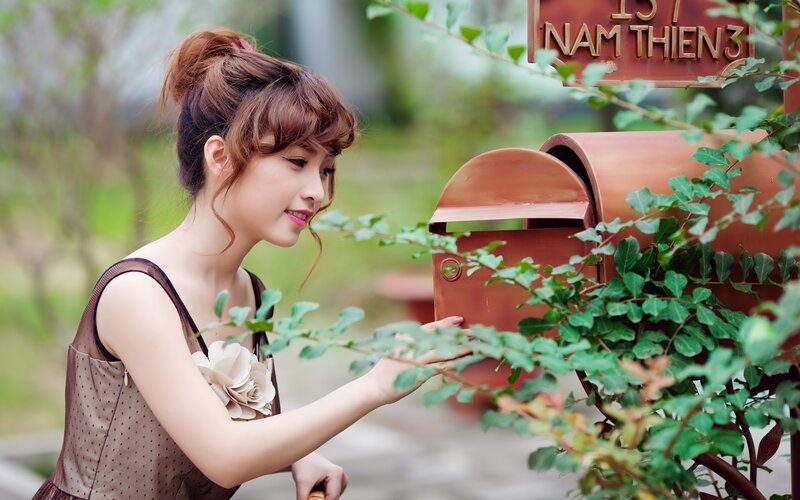 woman at a mailbox