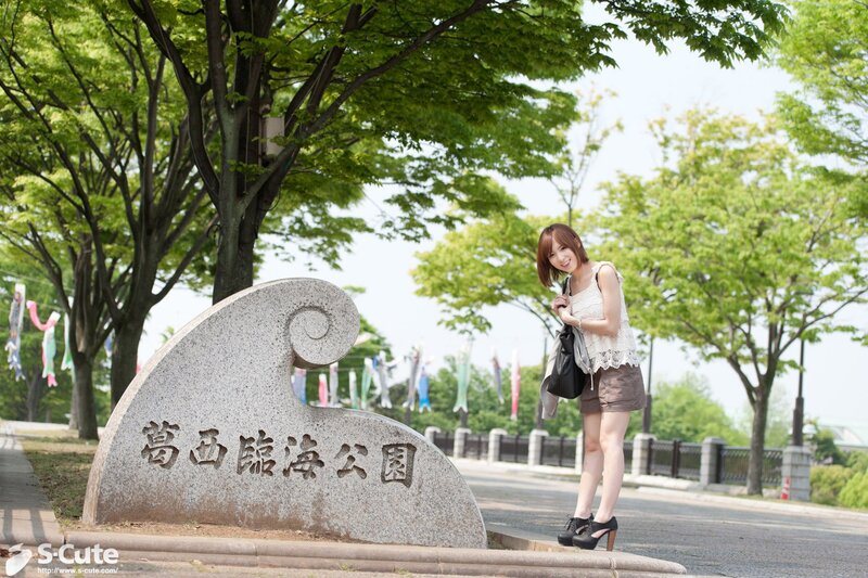 Woman at a park entrance