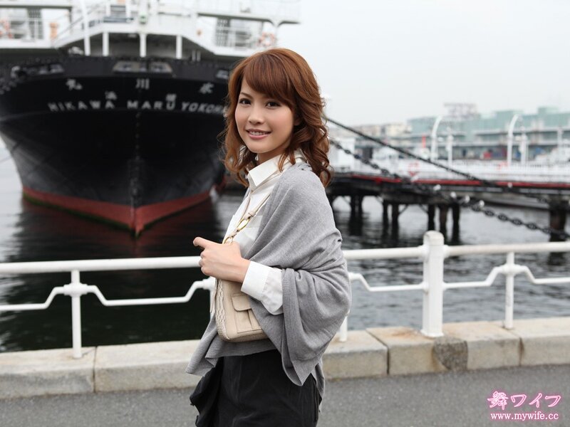 Woman at a port with a ship