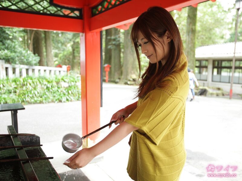 Woman at a shrine water basin
