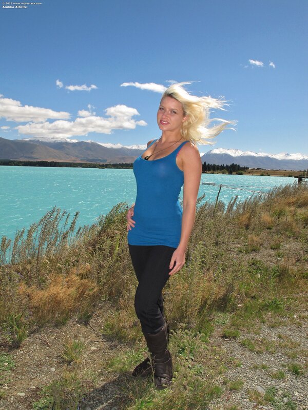 Woman at a turquoise lake