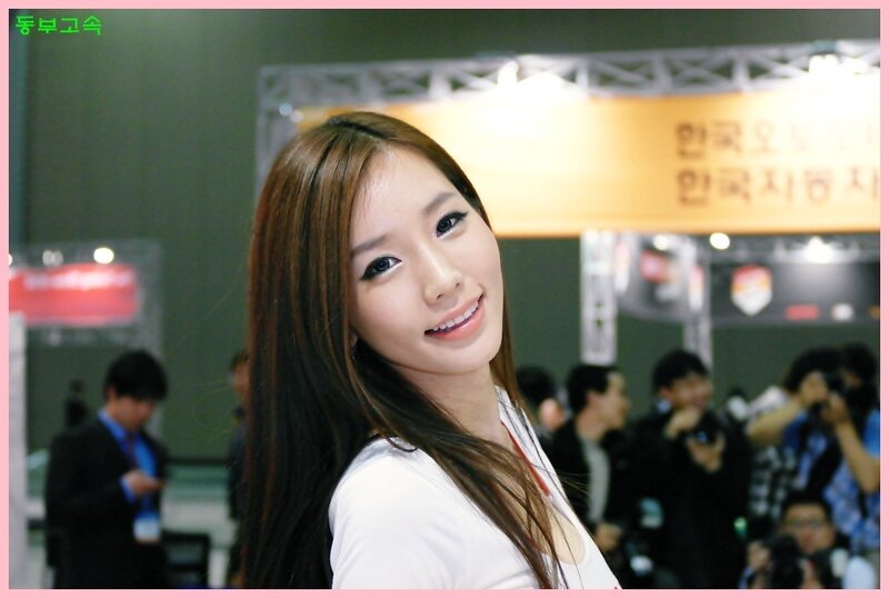 woman at an event smiling