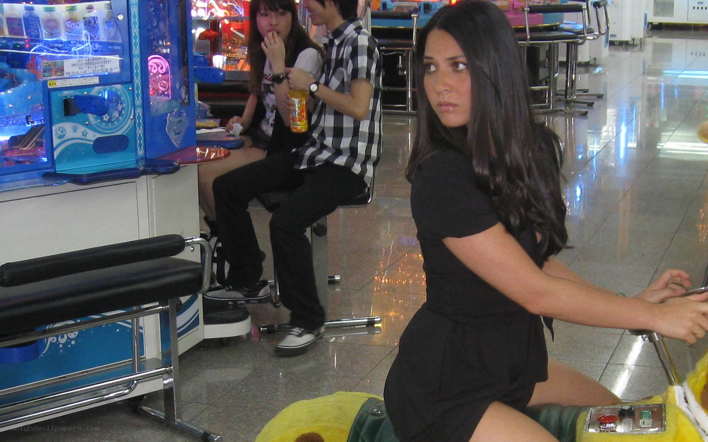 Woman at arcade game
