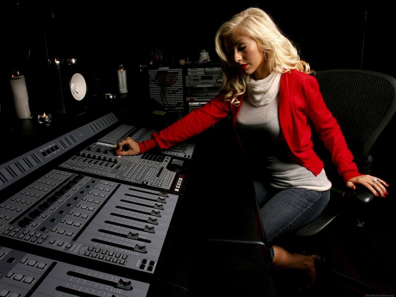 woman at audio mixing console