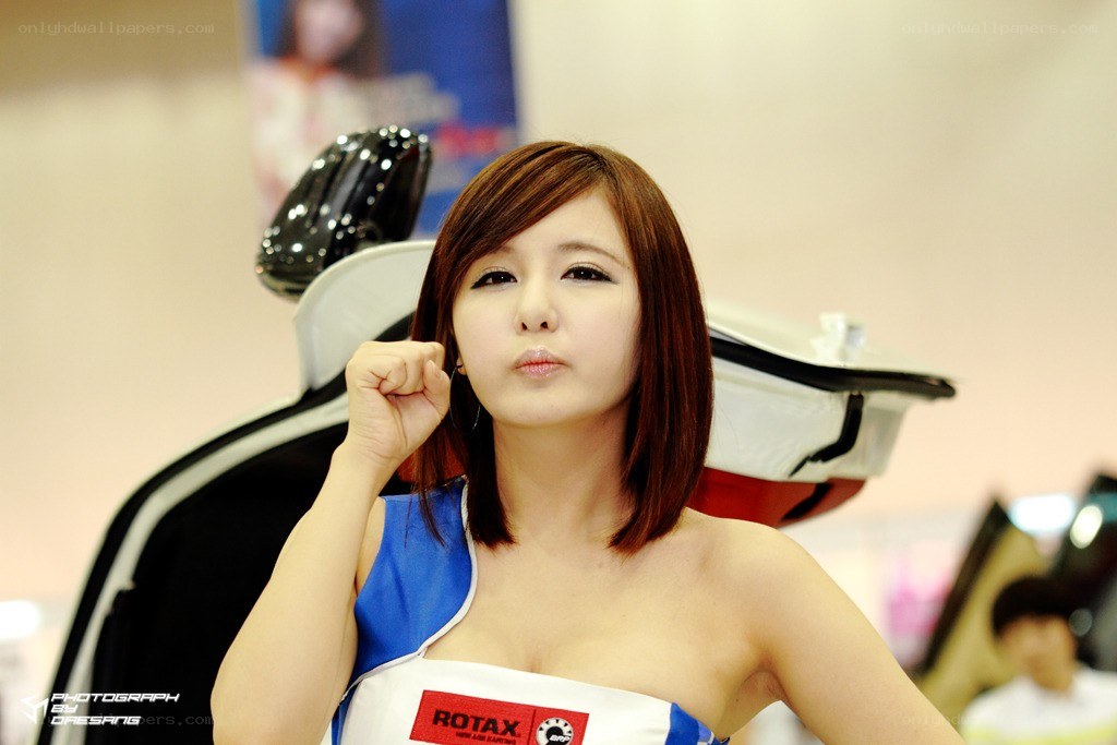 woman at auto show posing