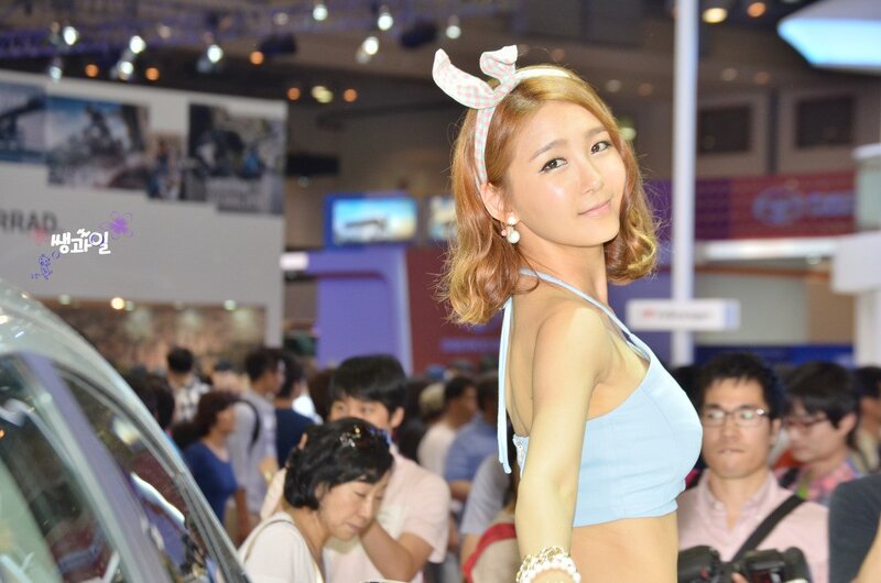 Woman at auto show with bow