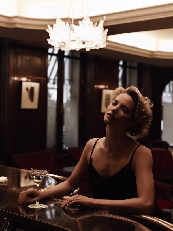 Woman at bar with cocktail