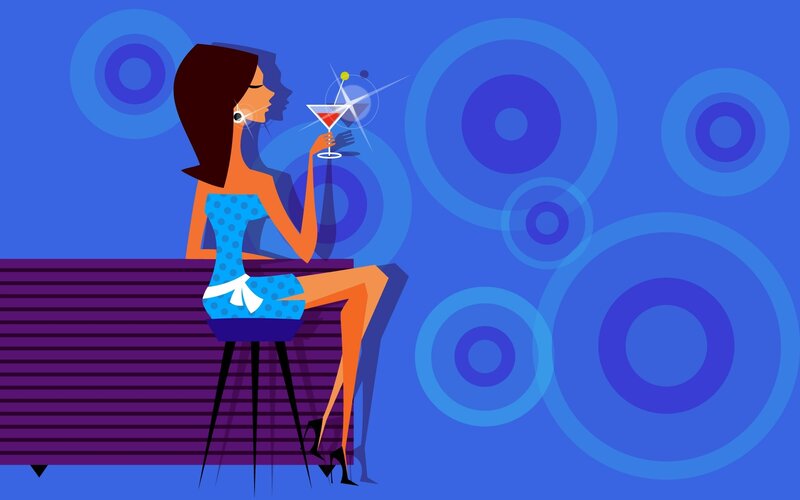 woman at bar with cocktail