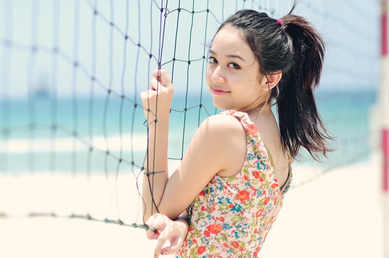 woman at beach volleyball net