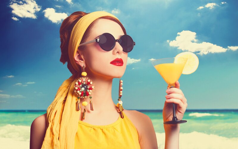 Woman at Beach with Cocktail