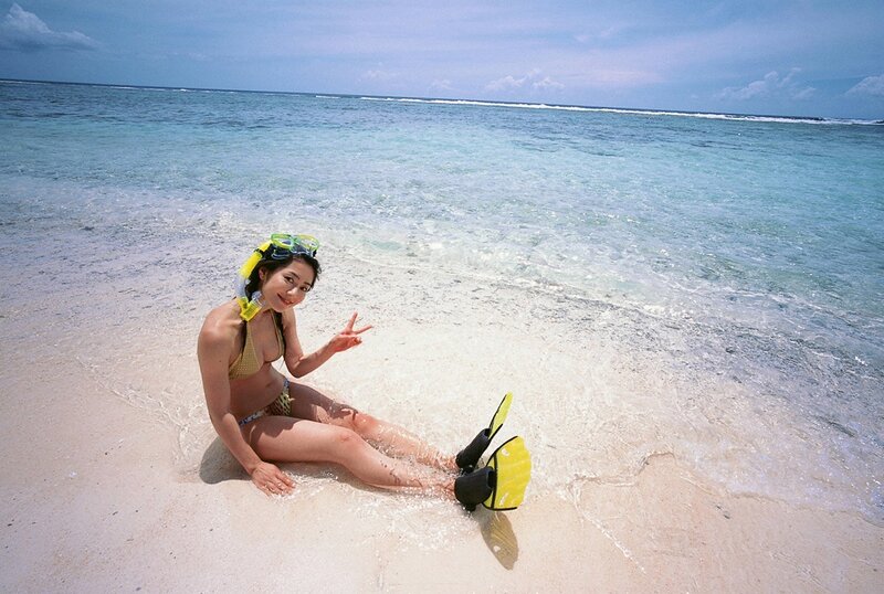 Woman at beach with snorkel gear