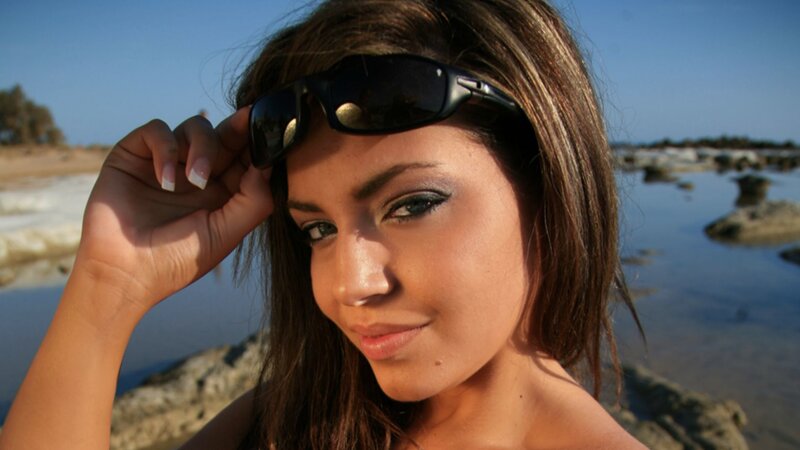 Woman at Beach with Sunglasses