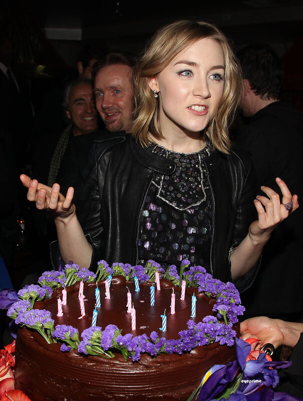 Woman at birthday party with cake